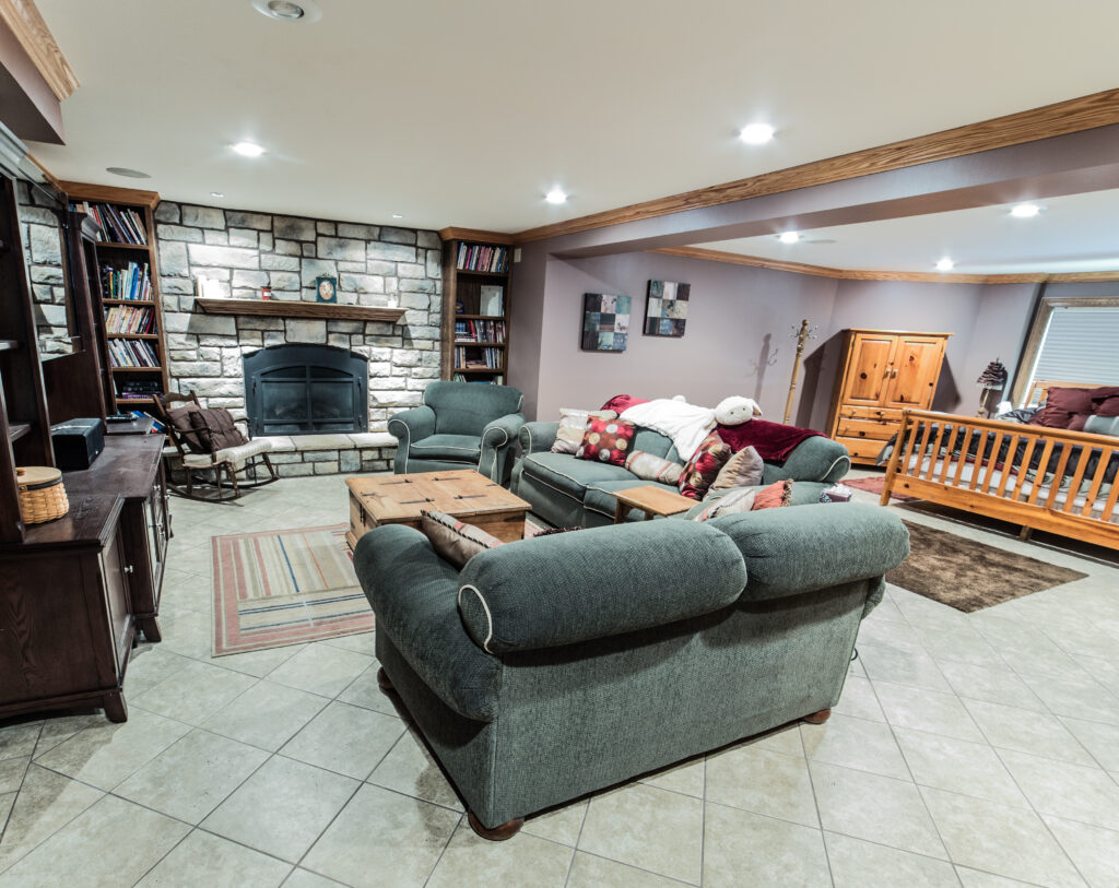 basement family room with light colored tile flooring