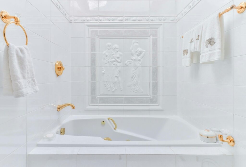 All white tiles and grout on tub surround
