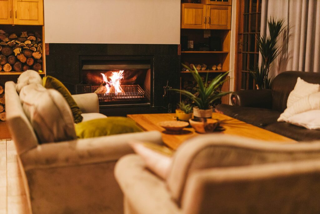 Cozy room with modern black tile fireplace. Tips for cleaning fireplace tiles
