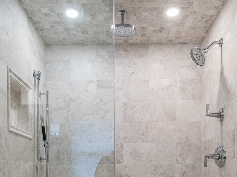 Shower with tiled walls and ceiling
